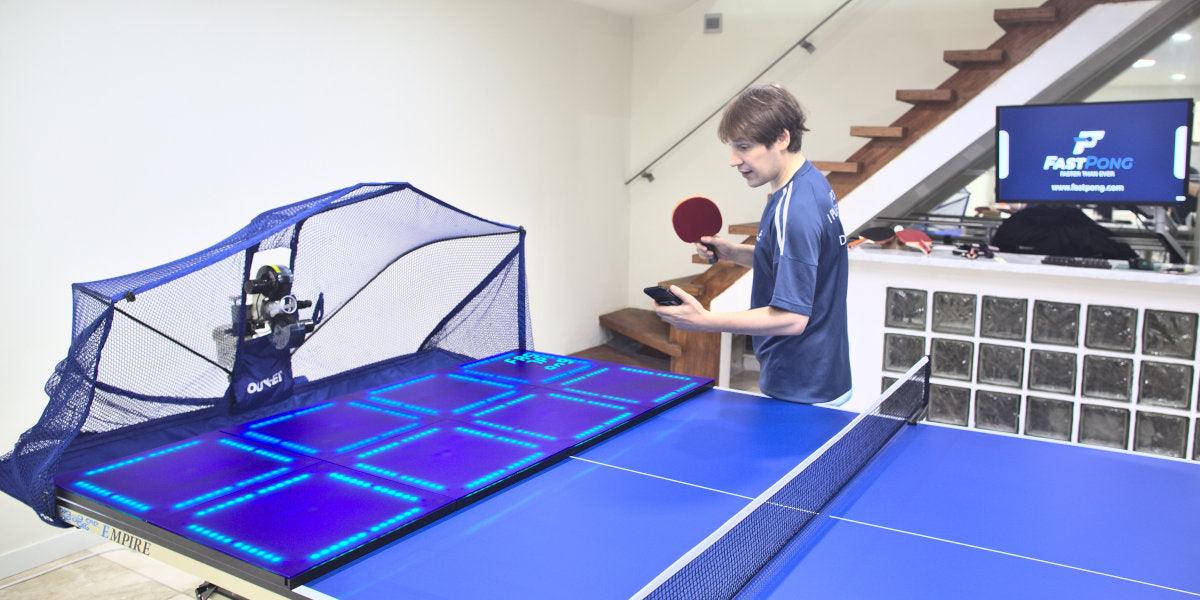 Showing the Fastpong table tennis system in a home setting.